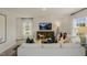 Bright living room featuring a comfortable sofa and large windows at 113 Reagan Crest Dr, Clayton, NC 27520