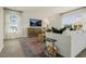 Living room with a white sofa, wood coffee table, and large windows at 113 Reagan Crest Dr, Clayton, NC 27520