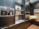 Butler's pantry with custom cabinetry, high-end appliances, and a coffee bar at 1425 Sky Vista Way, Raleigh, NC 27613