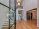 Bright and spacious entryway with a grand staircase and elegant chandelier at 1425 Sky Vista Way, Raleigh, NC 27613