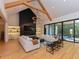 Open concept living area with high ceilings, a fireplace, and large windows at 1425 Sky Vista Way, Raleigh, NC 27613