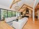 Open concept living room and kitchen with high ceilings and wooden beams at 1425 Sky Vista Way, Raleigh, NC 27613