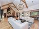 Open concept living room and kitchen with high ceilings and wooden beams at 1425 Sky Vista Way, Raleigh, NC 27613