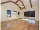 Spacious main bedroom with hardwood floors, high ceilings, and large windows at 1425 Sky Vista Way, Raleigh, NC 27613