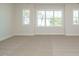 Spacious bedroom with large windows and carpet at 1809 Bright Lantern Way, Wendell, NC 27591