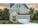 Two-story home with gray siding, brick accents, and a white garage door at 1809 Bright Lantern Way, Wendell, NC 27591