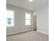 Spacious bedroom with carpet flooring and two large windows at 1812 Bright Lantern Way, Wendell, NC 27591