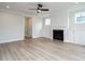 Open living room with fireplace and hardwood floors at 1812 Bright Lantern Way, Wendell, NC 27591