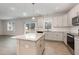 Island kitchen with granite countertops and view of backyard at 188 Avery Meadows Dr, Smithfield, NC 27577