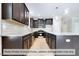 Modern kitchen with dark cabinetry, granite countertops, and an island at 1981 Meadowview Dr, Graham, NC 27253