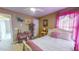 Charming bedroom with a pink theme and built-in shelving at 203 Barrington Overlook Dr, Durham, NC 27703