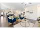 Open concept living area showcasing kitchen and dining spaces at 225 Sage Oak Ln, Holly Springs, NC 27540