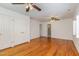 Bedroom with hardwood floors, double closets, and ceiling fans at 307 Country Club Dr, Durham, NC 27712