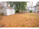 Backyard view showcasing a shed and grassy area at 421 S Morgan St, Roxboro, NC 27573