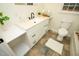 Updated bathroom with white vanity, new tile flooring, and modern fixtures at 421 S Morgan St, Roxboro, NC 27573