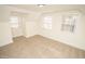 Bright bedroom with two windows and carpet at 421 S Morgan St, Roxboro, NC 27573
