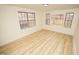 Bedroom with hardwood floors and large windows at 421 S Morgan St, Roxboro, NC 27573