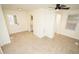 Bright bedroom with new carpet, door to outside, and access to bathroom at 421 S Morgan St, Roxboro, NC 27573