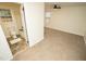 Bedroom with carpet, ceiling fan and bathroom access at 421 S Morgan St, Roxboro, NC 27573