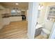 Modern kitchen with white cabinets, granite countertops, and new appliances at 421 S Morgan St, Roxboro, NC 27573