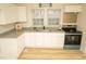 Updated kitchen with white cabinets and granite countertops at 421 S Morgan St, Roxboro, NC 27573
