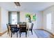 Bright dining room with wooden table and black chairs at 507 Fife Ct, Gibsonville, NC 27249