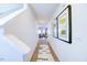 Clean hallway with wood-look flooring and modern artwork at 507 Fife Ct, Gibsonville, NC 27249