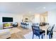 Open concept kitchen and dining area with modern appliances and breakfast bar at 507 Fife Ct, Gibsonville, NC 27249
