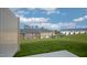 Landscaped backyard with grassy area and community view at 508 Fife Ct, Gibsonville, NC 27249
