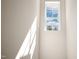Bright hallway with a window offering natural light and a view of the outdoors at 508 Fife Ct, Gibsonville, NC 27249