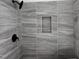 Modern shower with grey tile and built-in shelf at 5168 Church Rd # 22, New Hill, NC 27562