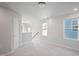 Bright loft area with two windows and neutral carpeting at 532 Hanover Shore Ln # 714 Oakley, Raleigh, NC 27610