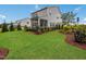 Spacious backyard with a two-story home and screened porch at 536 Hanover Shore Ln, Raleigh, NC 27610