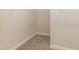 Spacious walk-in closet with wire shelving and neutral carpeting at 587 Glenkirk Pl, Garner, NC 27529