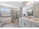 Elegant bathroom with double vanity, soaking tub, and shower at 601 Emerald Bay Cir, Raleigh, NC 27610