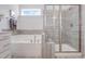 Bathroom with soaking tub and walk-in shower at 601 Emerald Bay Cir, Raleigh, NC 27610