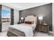 Bedroom with patterned wallpaper and a comfy bed at 601 Emerald Bay Cir, Raleigh, NC 27610