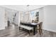 Dining area with hardwood floors and access to entryway at 601 Emerald Bay Cir, Raleigh, NC 27610