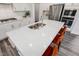 Kitchen island with white countertop and orange barstools at 601 Emerald Bay Cir, Raleigh, NC 27610