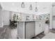 Kitchen island with stainless steel dishwasher and white cabinets at 601 Emerald Bay Cir, Raleigh, NC 27610