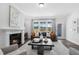 Living room features a fireplace and access to backyard at 601 Emerald Bay Cir, Raleigh, NC 27610
