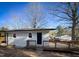 Spacious back deck with wooden railings and steps at 603 Forest Dr, Garner, NC 27529