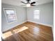 Bright bedroom with hardwood floors and large windows at 603 Forest Dr, Garner, NC 27529