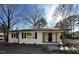 Updated ranch home features a charming front porch and brick facade at 603 Forest Dr, Garner, NC 27529