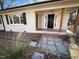 Inviting front porch with brick flooring and wood columns at 603 Forest Dr, Garner, NC 27529