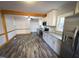 Modern kitchen with stainless steel appliances and granite countertops at 603 Forest Dr, Garner, NC 27529