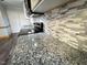 Granite countertops and updated backsplash in the kitchen at 603 Forest Dr, Garner, NC 27529
