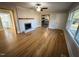 Spacious living room with hardwood floors and fireplace, views into kitchen at 603 Forest Dr, Garner, NC 27529