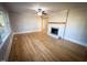 Bright living room with hardwood floors, fireplace, and lots of natural light at 603 Forest Dr, Garner, NC 27529