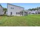 Home features a screened porch and grassy backyard at 604 Emerald Bay Cir, Raleigh, NC 27610